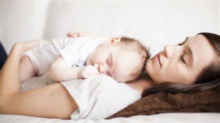 Can newborn sleep with Mom?