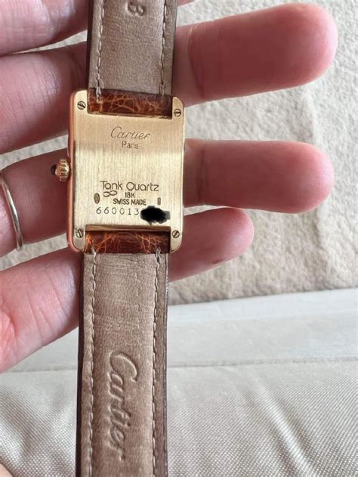 How do I find the serial number on my Cartier bracelet?